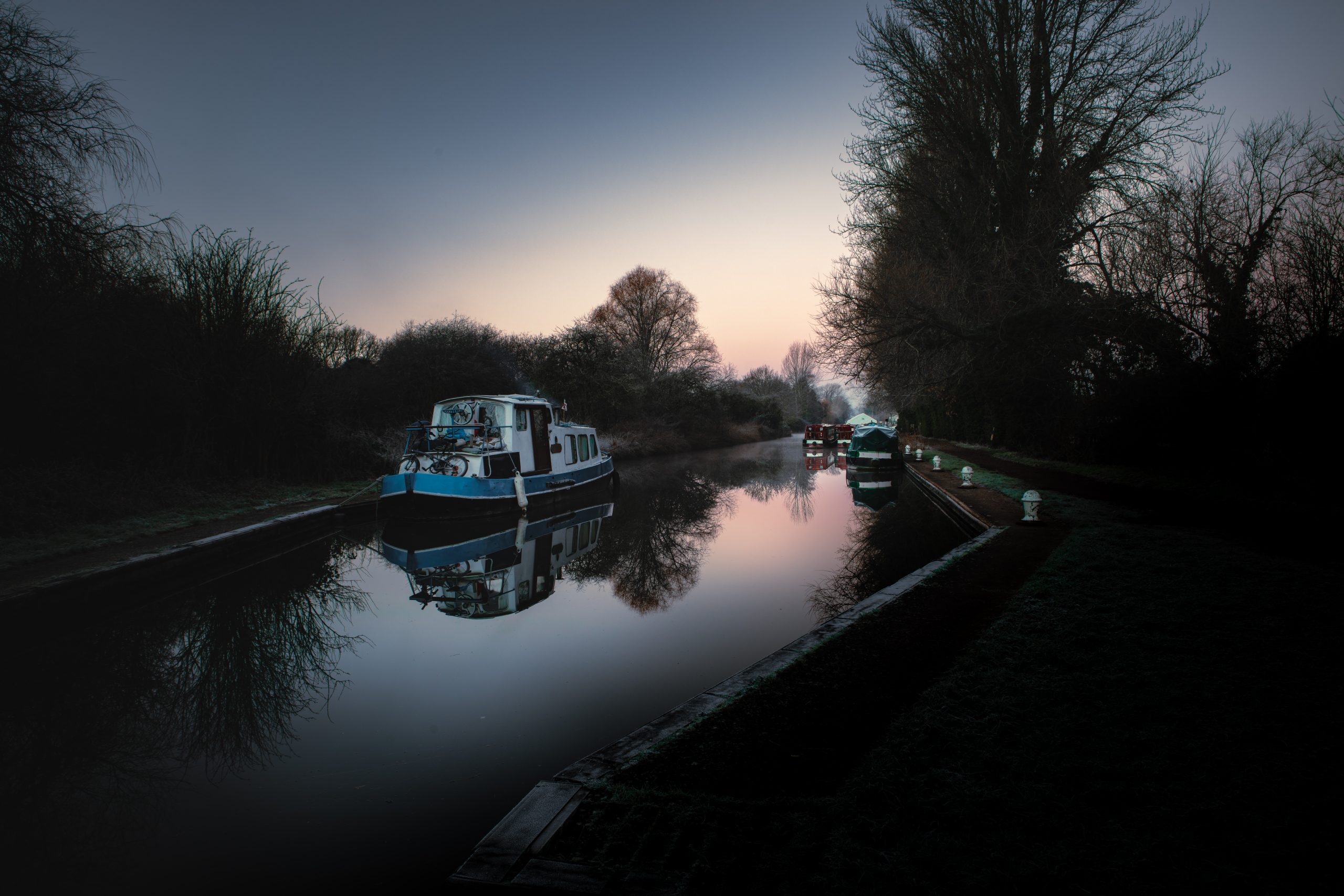 Early winter morning on the Kennet and Avon Canal, deep shadows and crushed blacks in the photograph enhancing the cold, stark atmosphere without snow or ice.
