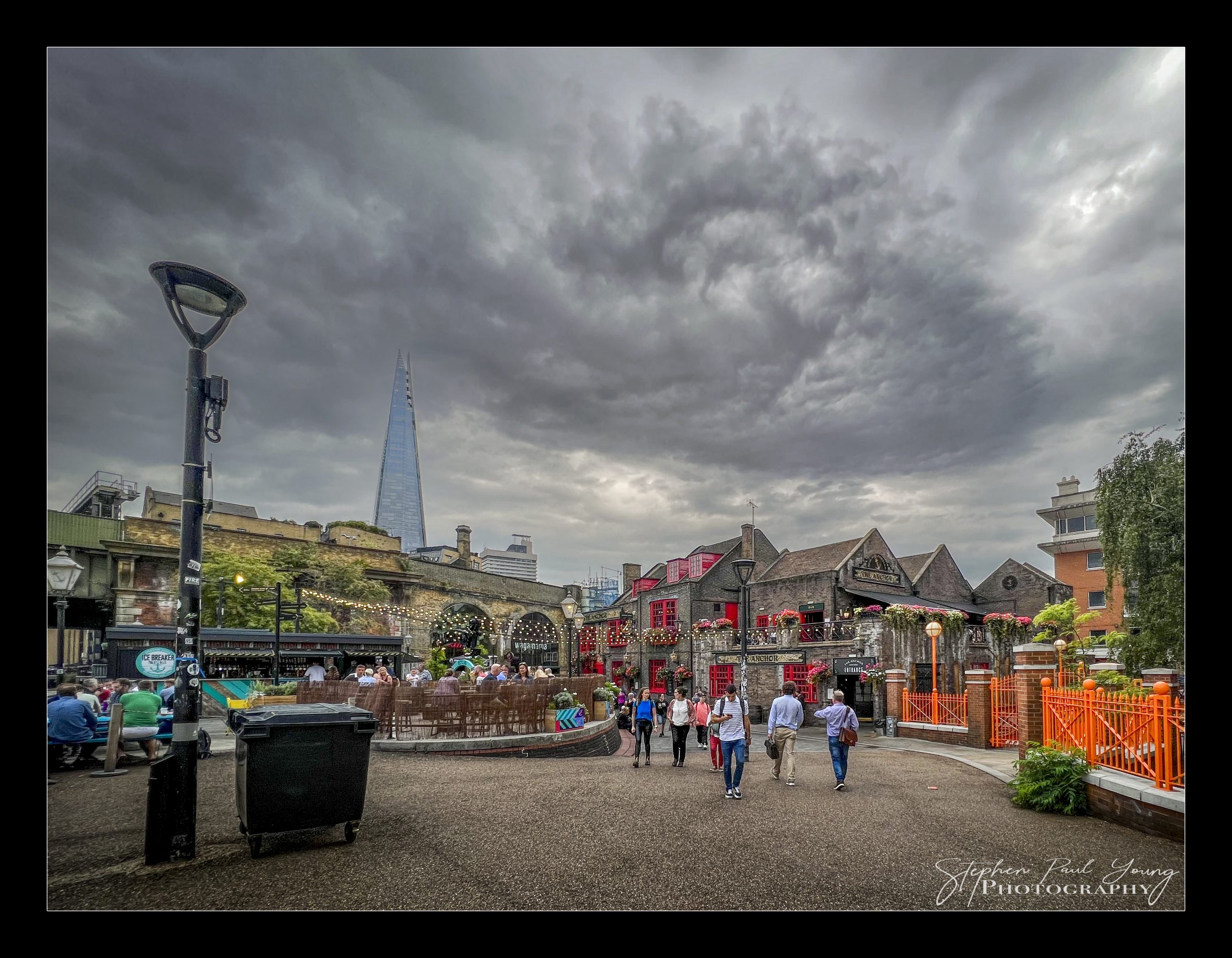 Indulge in 6 Savoury Photographs of Borough Market London: A Photographer's Gastronomic Delight 2 Borough Market in London bustling with stalls and shoppers, showcasing fresh produce and vibrant city atmosphere.