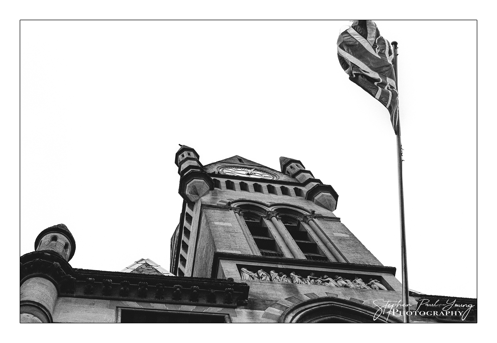 What is film photography showing a flag flying outside Winchesters Town Hall.